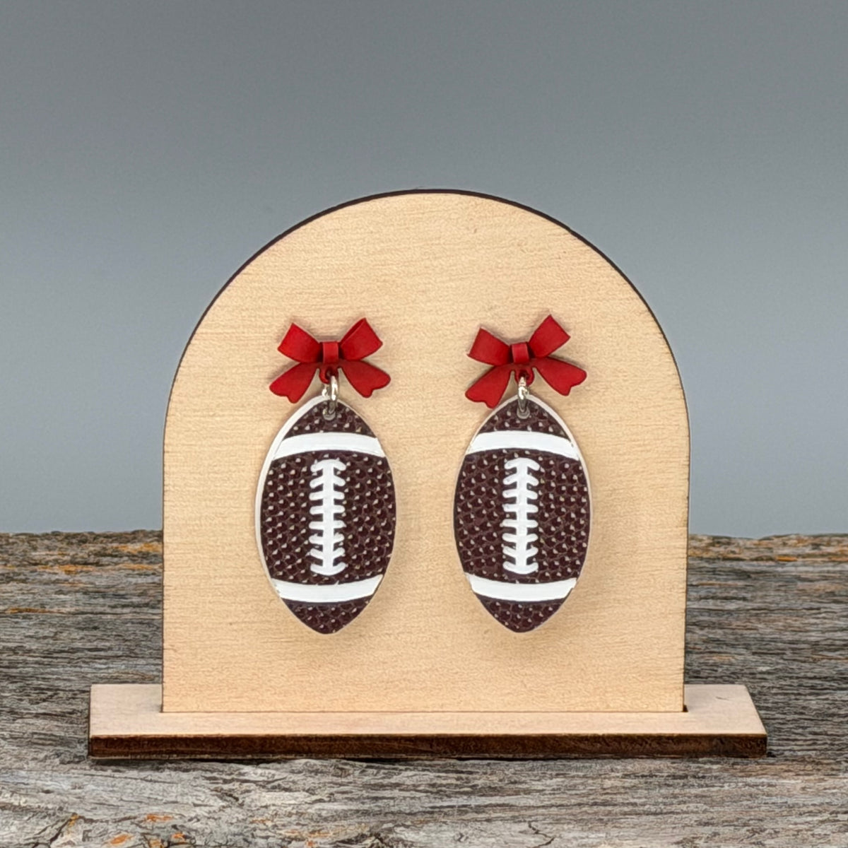 Football with Red Bow dangle earrings